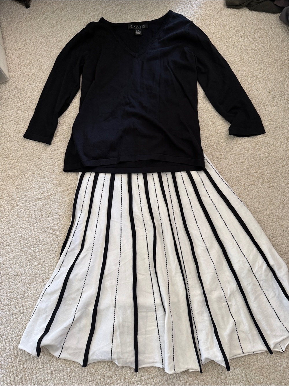 Dialogue 2 piece outfit with a pullover top and a black & white striped skirt